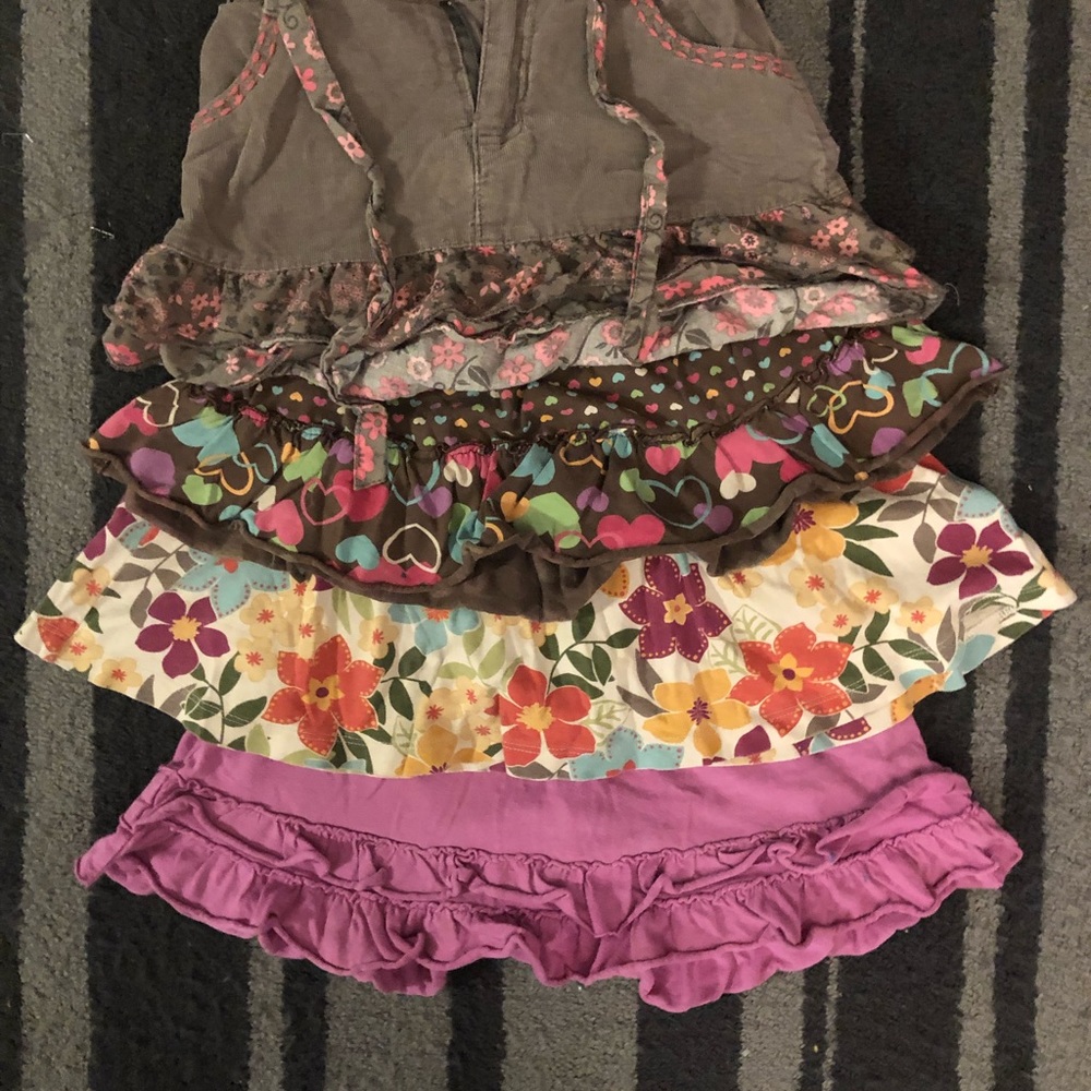 A set of four skirts/skorts sizes 6-7Y